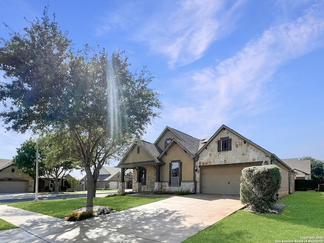 view of front of home with concrete driveway, stone siding, a front yard, and a garage