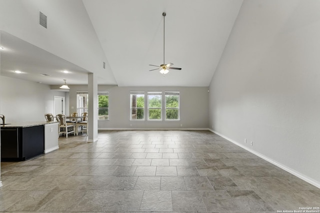 14626 Costa Leon, San Antonio, TX 78245 - unfurnished living room with baseboards, a ceiling fan, and visible vents