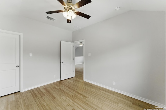 14626 Costa Leon, San Antonio, TX 78245 - unfurnished bedroom featuring baseboards, visible vents, light wood-style flooring, and lofted ceiling