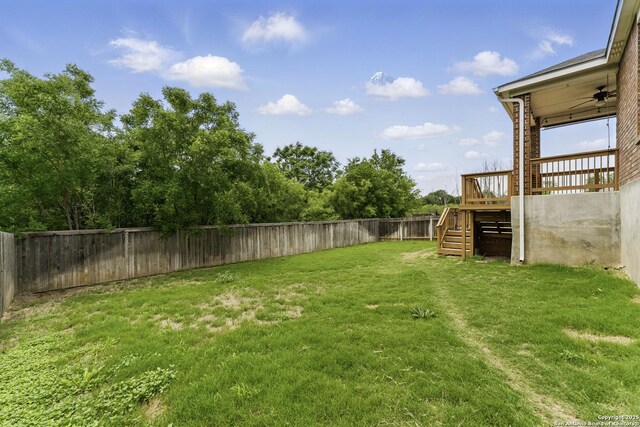 14626 Costa Leon, San Antonio, TX 78245 - view of yard featuring a fenced backyard, a wooden deck, and stairway