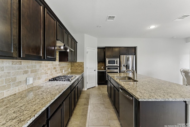 14626 Costa Leon, San Antonio, TX 78245 - kitchen featuring under cabinet range hood, visible vents, a sink, a center island with sink, and appliances with stainless steel finishes