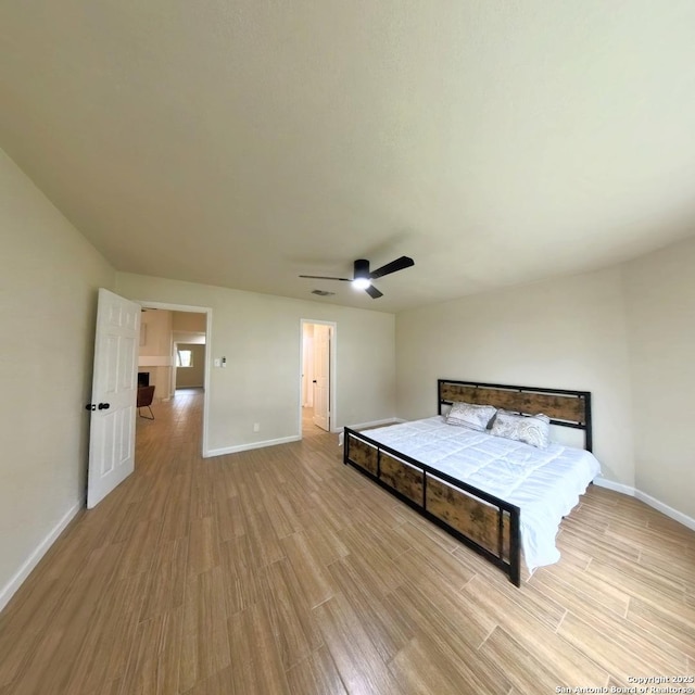 13243 Larkfield, San Antonio, TX 78233 - unfurnished bedroom with light wood-type flooring, baseboards, and ceiling fan