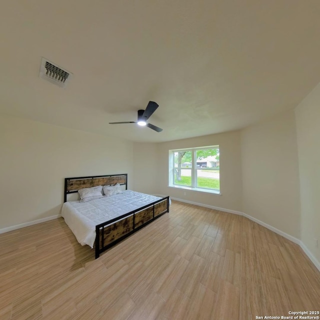 13243 Larkfield, San Antonio, TX 78233 - bedroom featuring ceiling fan, baseboards, light wood-type flooring, and visible vents