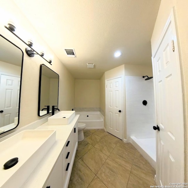 13243 Larkfield, San Antonio, TX 78233 - full bathroom with walk in shower, double vanity, visible vents, and a sink