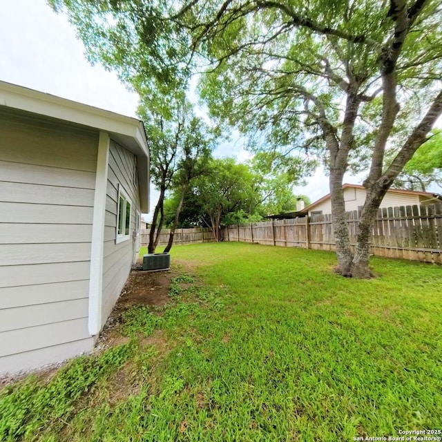 13243 Larkfield, San Antonio, TX 78233 - view of yard with central AC unit and a fenced backyard