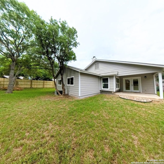 13243 Larkfield, San Antonio, TX 78233 - rear view of property featuring a yard, fence, french doors, and a patio area