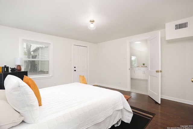 308 Andrews, San Antonio, TX 78209 - bedroom with wood finished floors, visible vents, baseboards, and ensuite bathroom