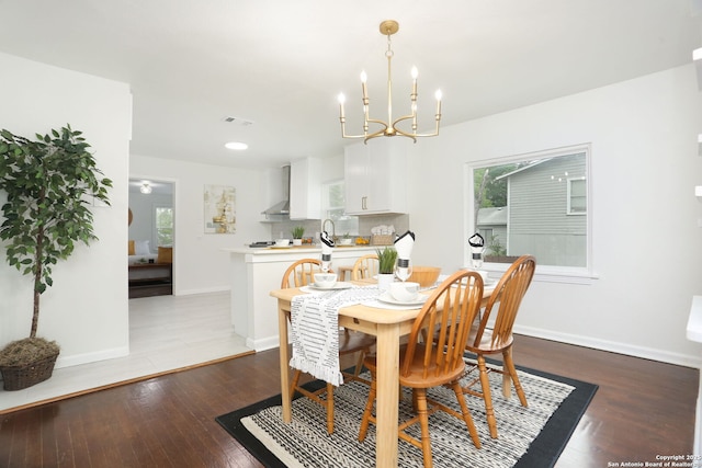 308 Andrews, San Antonio, TX 78209 - dining room with visible vents, baseboards, hardwood / wood-style floors, and a notable chandelier