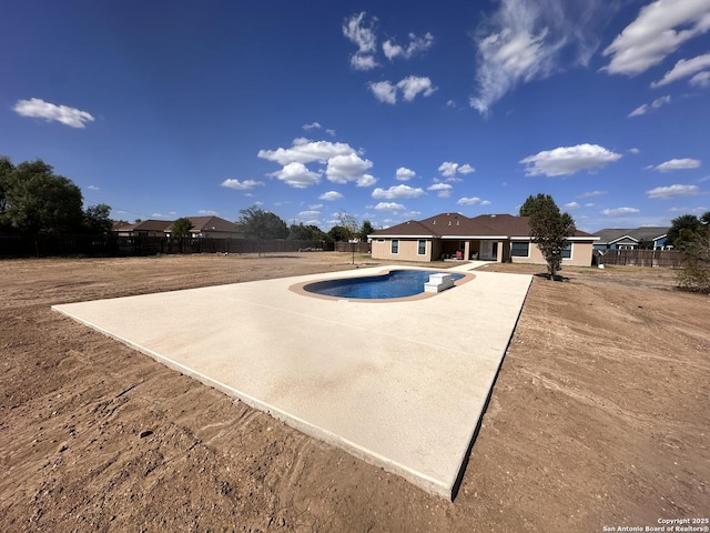 view of swimming pool with a fenced backyard, a patio area, and a fenced in pool