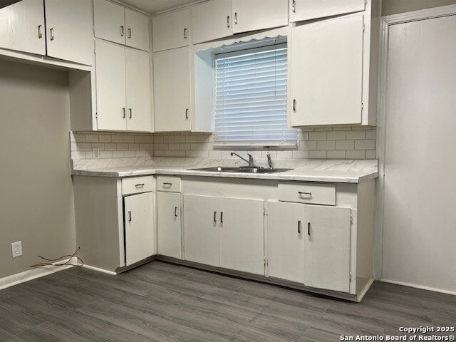 306 Lemur Dr, San Antonio, TX 78213 - kitchen with decorative backsplash, light countertops, and dark wood-style floors