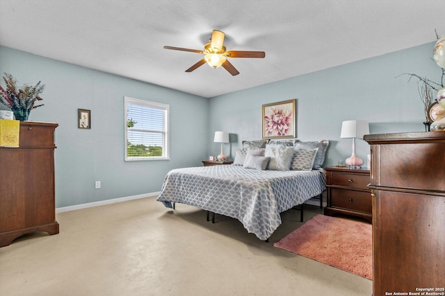 bedroom with concrete flooring, baseboards, and a ceiling fan
