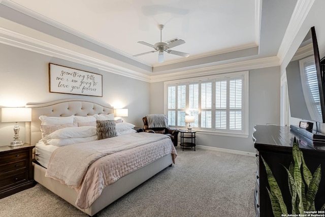 bedroom featuring baseboards, ornamental molding, visible vents, a raised ceiling, and light carpet