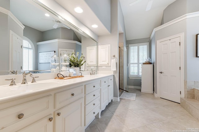 full bath with double vanity, a sink, a shower stall, lofted ceiling, and recessed lighting