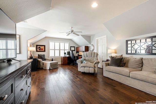 living room featuring vaulted ceiling, ceiling fan, and dark wood-style floors