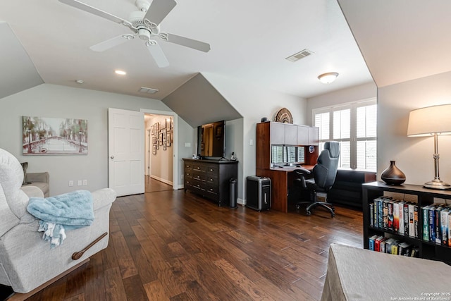 home office featuring a ceiling fan, visible vents, lofted ceiling, and dark wood-type flooring
