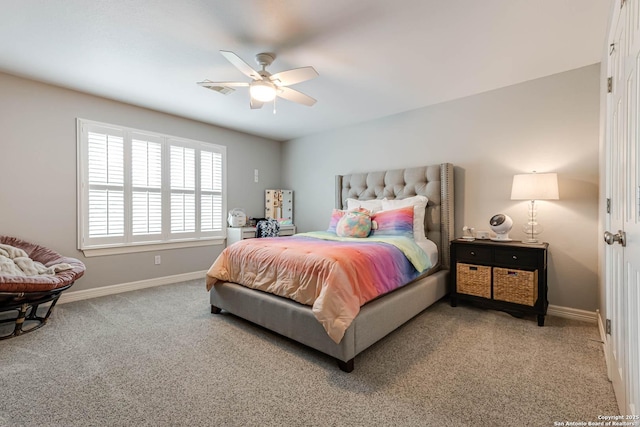 carpeted bedroom featuring ceiling fan and baseboards