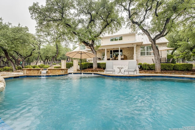 pool with outdoor dry bar and fence