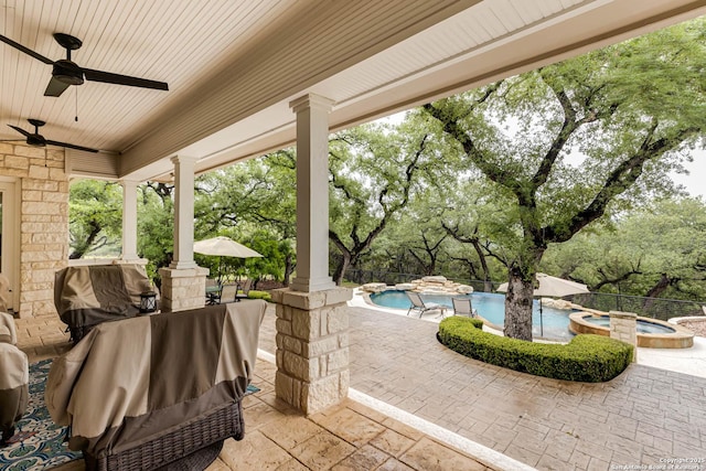 view of patio with a ceiling fan, grilling area, and a pool with connected hot tub