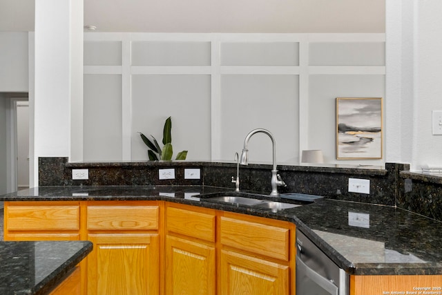 20437 Wild Spgs, San Antonio, TX 78258 - kitchen featuring dark stone counters, backsplash, stainless steel dishwasher, and a sink