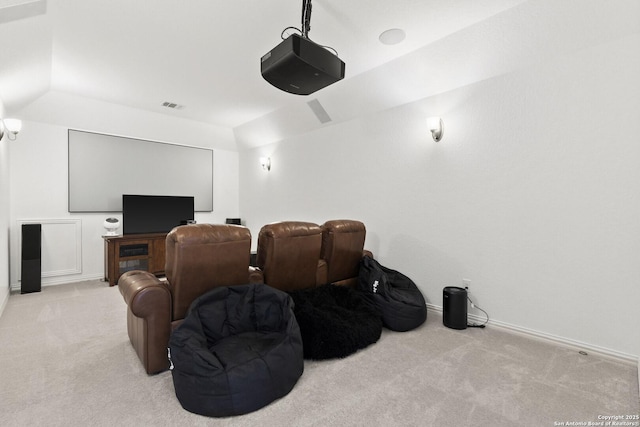 cinema featuring light carpet and baseboards