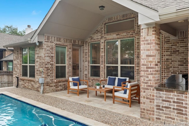 outdoor pool with a patio and fence