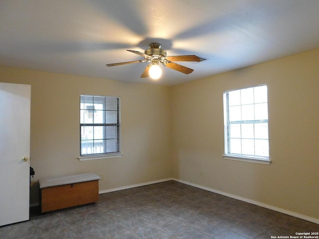 525 Cherry Rdg, Floresville, TX 78114 - spare room with healthy amount of natural light, ceiling fan, and baseboards