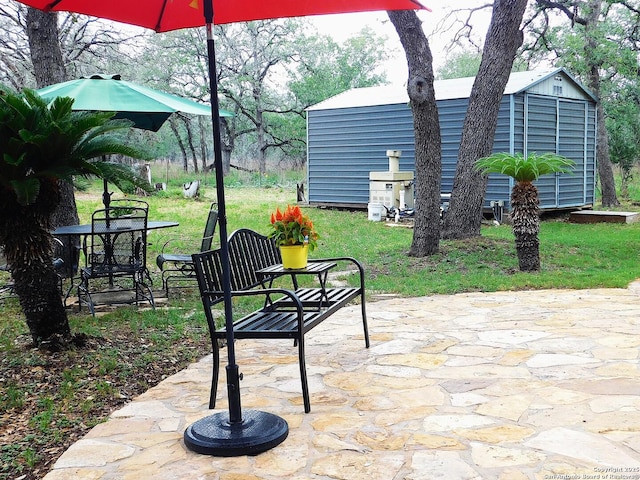 525 Cherry Rdg, Floresville, TX 78114 - view of patio / terrace with a storage unit and an outdoor structure
