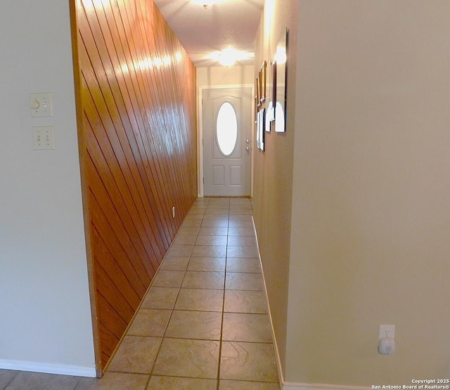 525 Cherry Rdg, Floresville, TX 78114 - doorway to outside with wooden walls, baseboards, and light tile patterned floors