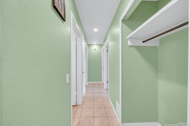 5118 War Cloud, San Antonio, TX 78242 - corridor featuring light tile patterned floors, a textured wall, recessed lighting, and baseboards
