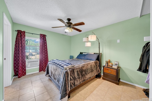 5118 War Cloud, San Antonio, TX 78242 - bedroom featuring a textured ceiling, ceiling fan, baseboards, cooling unit, and light tile patterned flooring