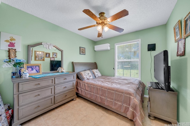 5118 War Cloud, San Antonio, TX 78242 - bedroom with a wall mounted air conditioner, light tile patterned flooring, a textured ceiling, and a ceiling fan