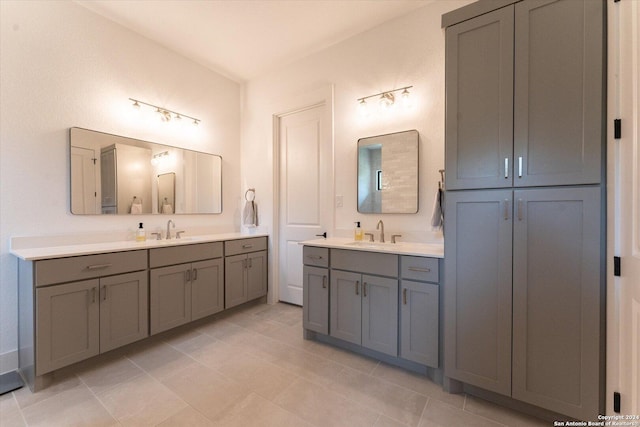bathroom with two vanities and tile patterned flooring
