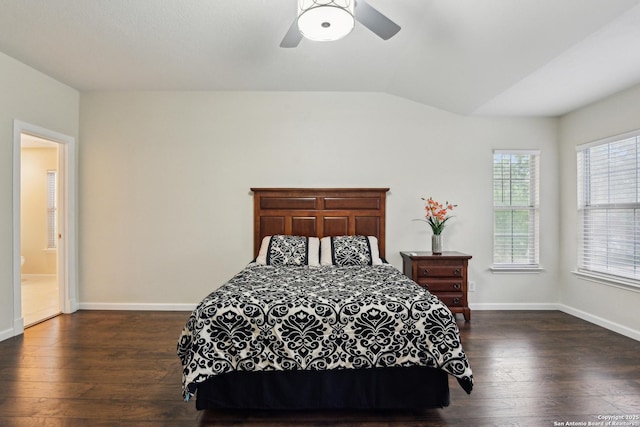 bedroom with dark wood-type flooring, lofted ceiling, baseboards, and ceiling fan