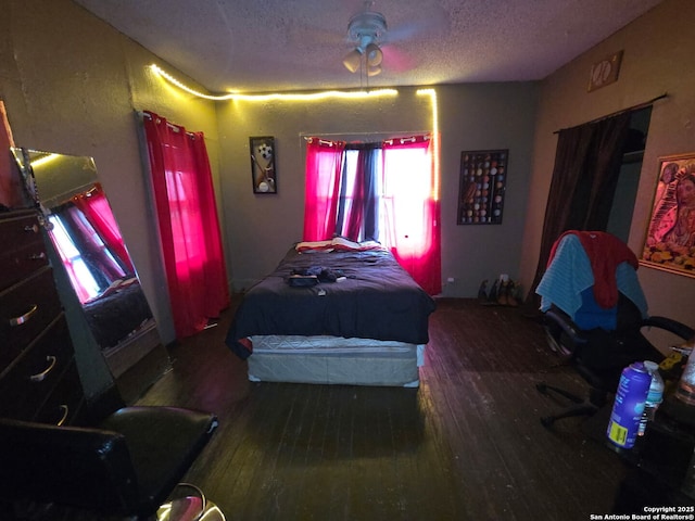 238 Lone Star, San Antonio, TX 78204 - bedroom featuring wood-type flooring, multiple windows, and a textured ceiling