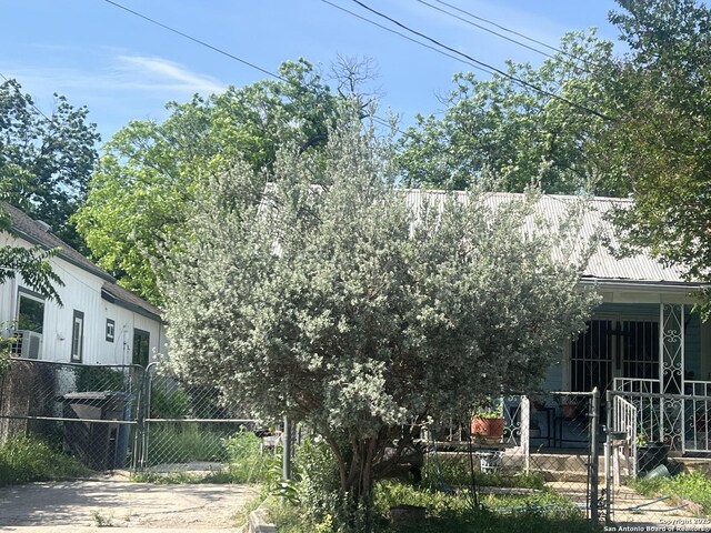 238 Lone Star, San Antonio, TX 78204 - rear view of house featuring metal roof and a gate