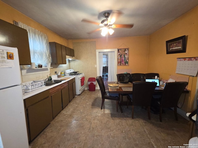 238 Lone Star, San Antonio, TX 78204 - kitchen with white appliances, a ceiling fan, light countertops, under cabinet range hood, and a sink
