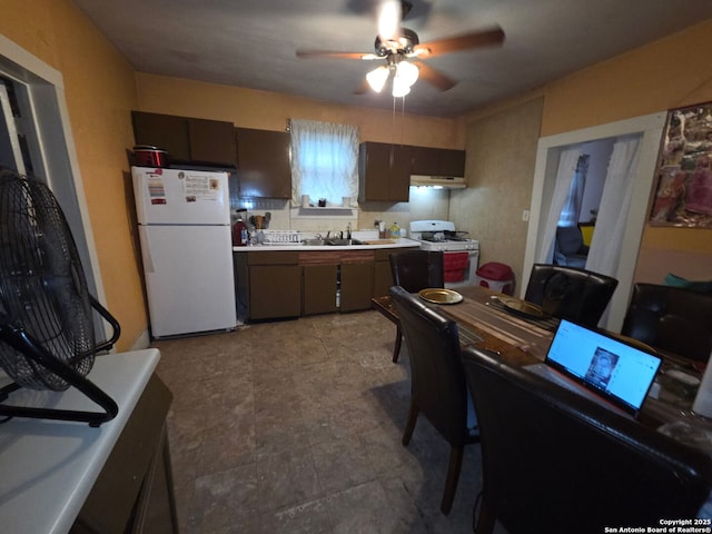 238 Lone Star, San Antonio, TX 78204 - kitchen with white appliances, a ceiling fan, light countertops, under cabinet range hood, and a sink