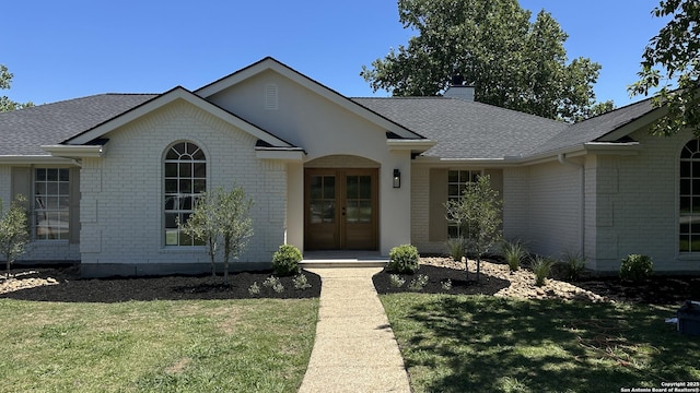 7335 Scintilla Ln, Boerne, TX 78015 - ranch-style home with brick siding, a front lawn, and a chimney