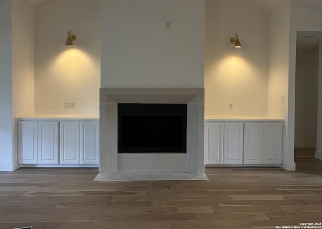 7335 Scintilla Ln, Boerne, TX 78015 - unfurnished living room with light wood finished floors and baseboards