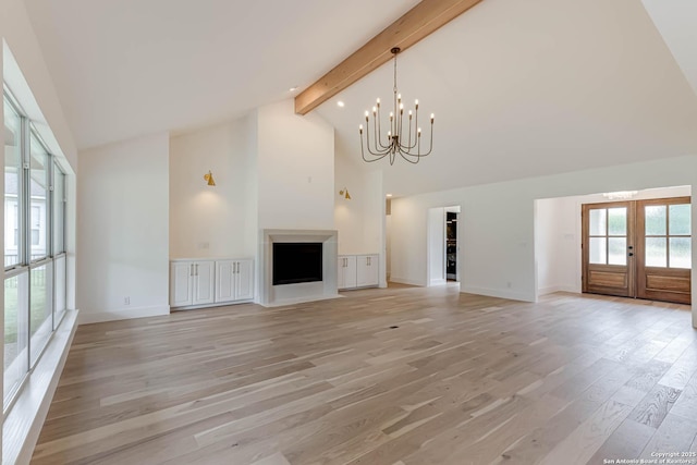 7335 Scintilla Ln, Boerne, TX 78015 - unfurnished living room featuring high vaulted ceiling, light wood-style flooring, beamed ceiling, french doors, and a chandelier