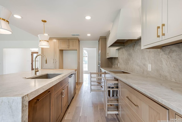 7335 Scintilla Ln, Boerne, TX 78015 - kitchen featuring a sink, dishwasher, light wood-style flooring, tasteful backsplash, and hanging light fixtures