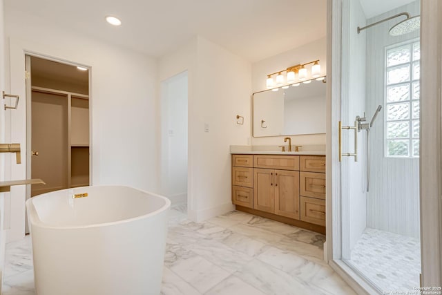 7335 Scintilla Ln, Boerne, TX 78015 - bathroom featuring marble finish floors, a shower stall, a soaking tub, vanity, and recessed lighting