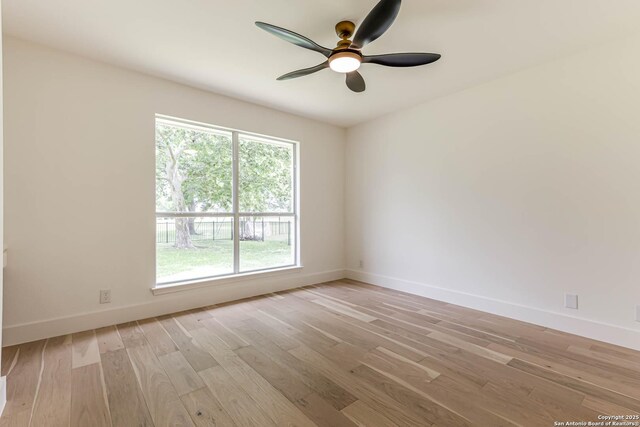 7335 Scintilla Ln, Boerne, TX 78015 - empty room featuring a ceiling fan, light wood-style floors, and baseboards