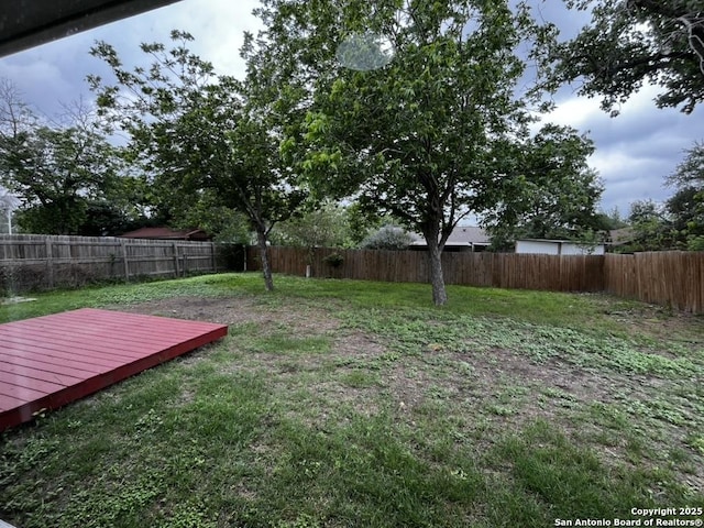 view of yard with a deck