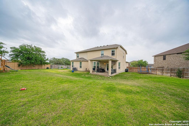 back of property with a patio and a playground