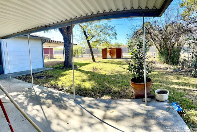 view of patio / terrace featuring a shed and an outdoor structure
