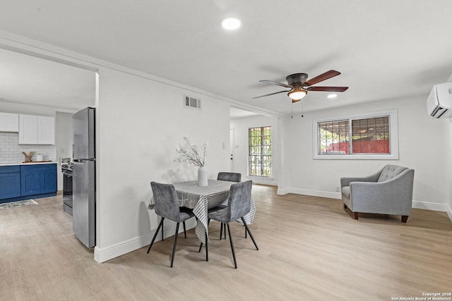 3327 K, San Antonio, TX 78220 - dining area featuring light wood finished floors, baseboards, a ceiling fan, a wall mounted air conditioner, and recessed lighting