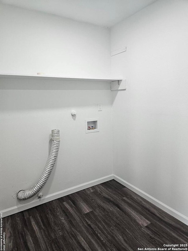 laundry room featuring hookup for a gas dryer, dark wood finished floors, washer hookup, and baseboards