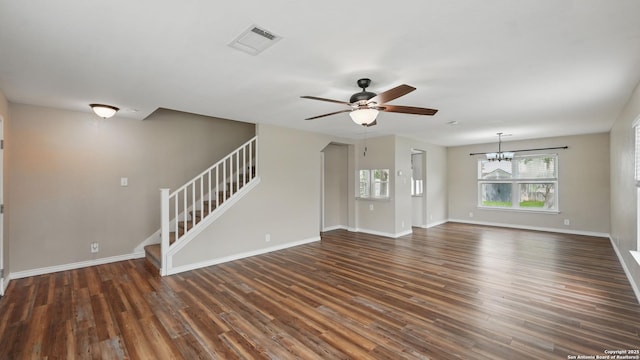 744 Pinehurst, New Braunfels, TX 78130 - unfurnished living room featuring stairs, a ceiling fan, dark wood-type flooring, and healthy amount of natural light