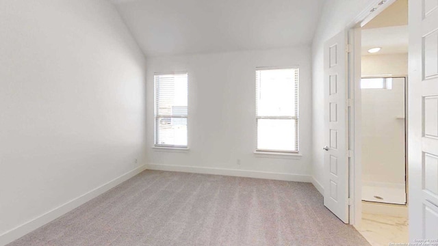 1818 Nettletree, New Braunfels, TX 78132 - spare room featuring baseboards, light carpet, and lofted ceiling